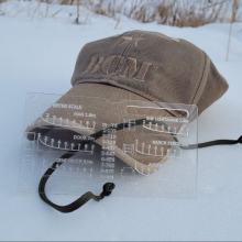 Black HIlls Designs RANGE-R Card next to a Bravo Company Machine hat