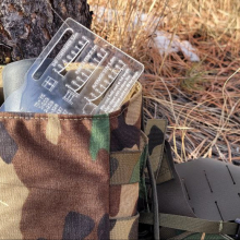 Black HIlls Designs RANGE-R Card fitting in a GP pouch alongside a pair of binoculars